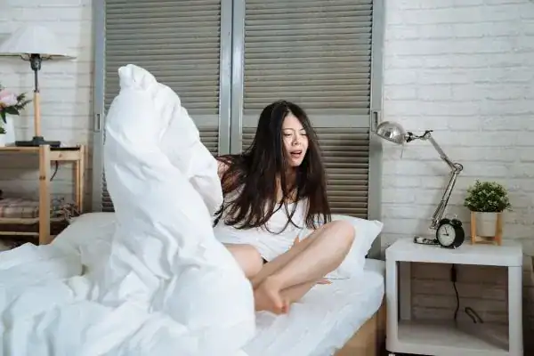 Image of woman getting up because of nighttime leaks Portsmouth